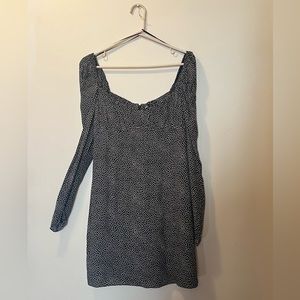 Long sleeve black dress with white polkadots